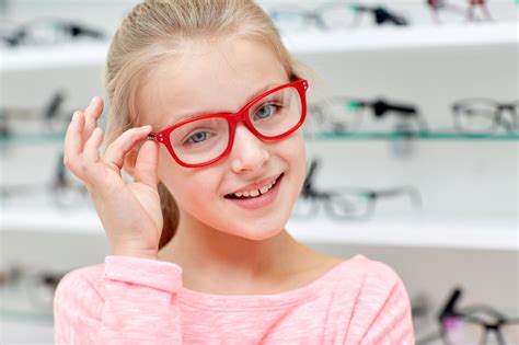 Little Girl In Glasses At Optics Store Magruder Eye Institute
