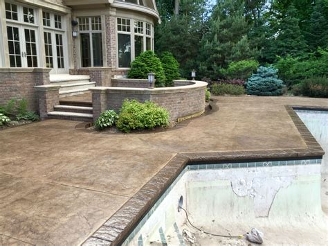 Stamped Concrete Pool Deck With Custom Chiseled Stone Cantilevered Coping By Sierra Concrete