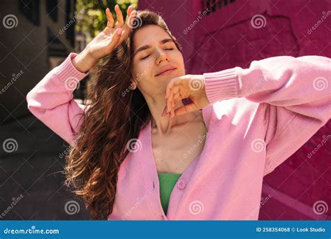 Tender Young Caucasian Woman Closing Her Eyes Relaxes Enjoying Sunshine