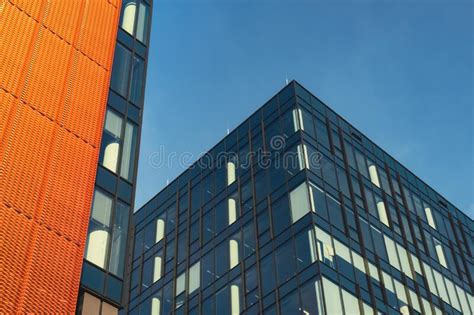 Modern Office Building Exterior With Glass Facade On Clear Sky