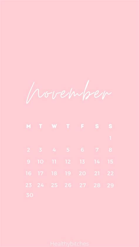 A Pink Calendar With The Word November Written In White Ink On A Light