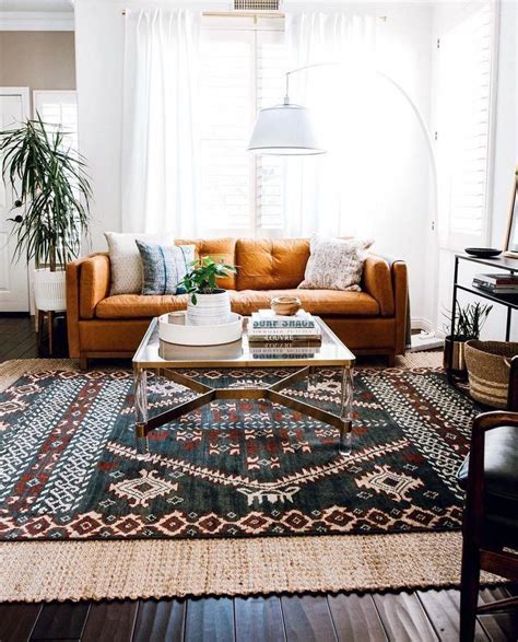 And a sofa is most definitely next on my wish list. warm living room // orange sofa // layered rugs | Living ...