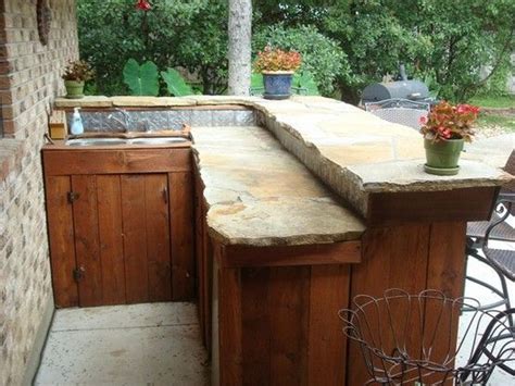 Check out our wood countertop selection for the very best in unique or custom, handmade pieces from our desks shops. whimsical slate stone and wood outdoor bar | Outdoor wood ...