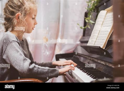 Little Girl Learning To Play The Piano Stock Photo Alamy