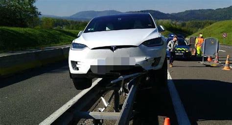 Tesla Model X Bizarrely Balances On Guardrail After Crash Carscoops
