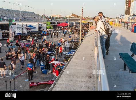 Spectators Watch Teams Prepare Race Cars At Daytona International