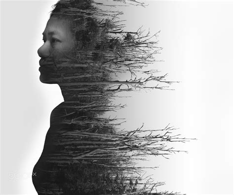 Double Exposure Portrait Of Young Woman And Dead Forest In Black And