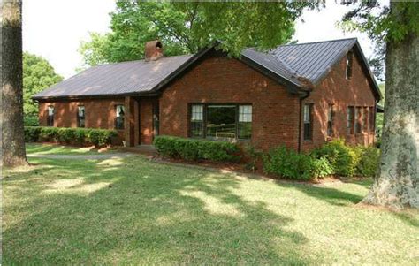 The most popular combination is painted house with white, cream, light gray, yellow pastel or light brown.but if you want a house look more strong and unique, you can try to paint the house in red. brick house brown metal roof - Google Search | Exterior brick