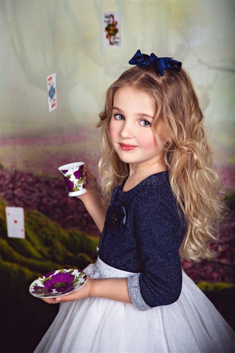 Little Girl As Alice In Wonderland Stock Photo Image Of Dress Beauty