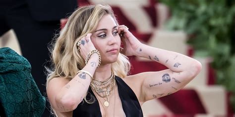 Miley Cyruss Tattoos Photos And Meaning Of Miley Cyrus Tattoos
