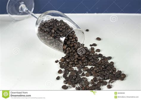 Glass coffee roasters, kinda sounds like we're roasting glass coffee beans. Wine Glass With Roasted Coffee Bean. Stock Image - Image of refreshment, black: 86096589