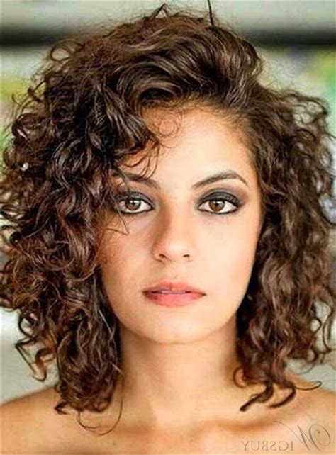 It requires growing out the curls to a specific length and then styling them in a fringe. 2020 Popular Curly Medium Hairstyles With Bangs