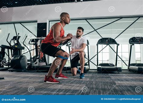 Attentive Trainer Looking At Young African Stock Photo Image Of