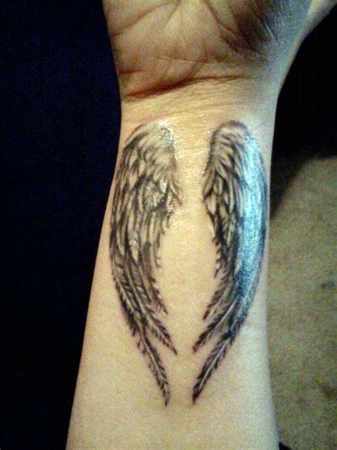 Angel wings tattoo behind the ear. Pin on wings