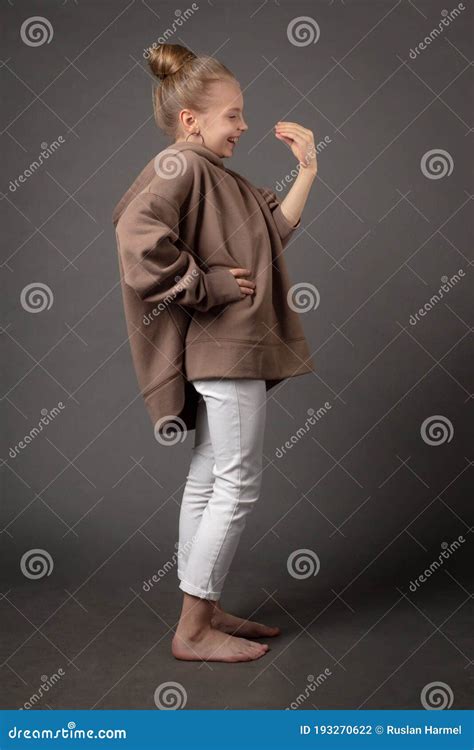 Child Girl With Long Hair Gathered In A Bun Stock Photo Image Of