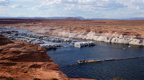Lake Powell Water Levels Hit Record Lows Forcing Off Some Houseboats