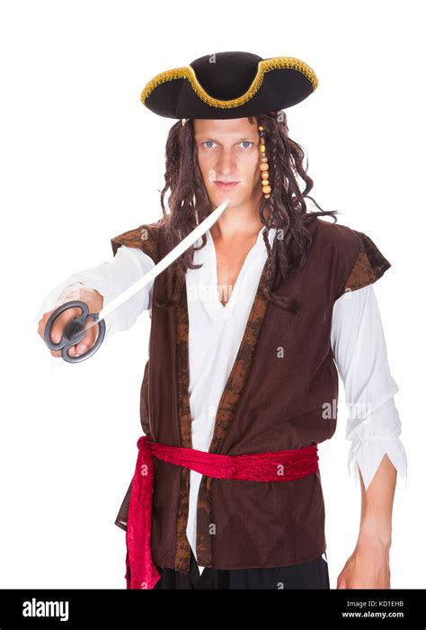 Portrait Of A Young Pirate Holding Sword On White Background Stock