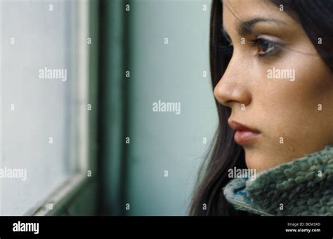 Young Woman Looking Out Window Crying Profile Stock Photo Alamy