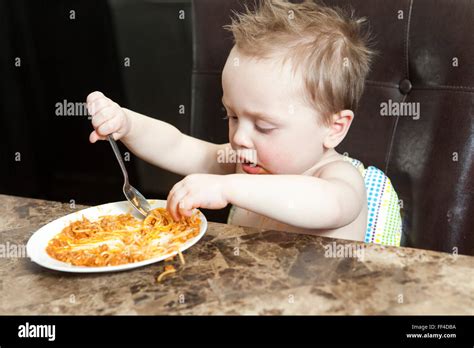 Adorable Little Boy Eating Pasta Indoor Toddler Child In Domestic
