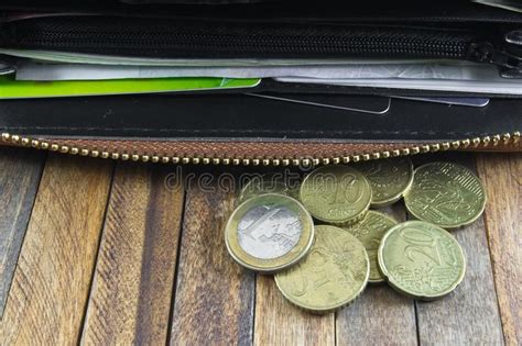 Have no more than 2 open credit card accounts with capital. Open wallet with money and credit cards. On wooden ...