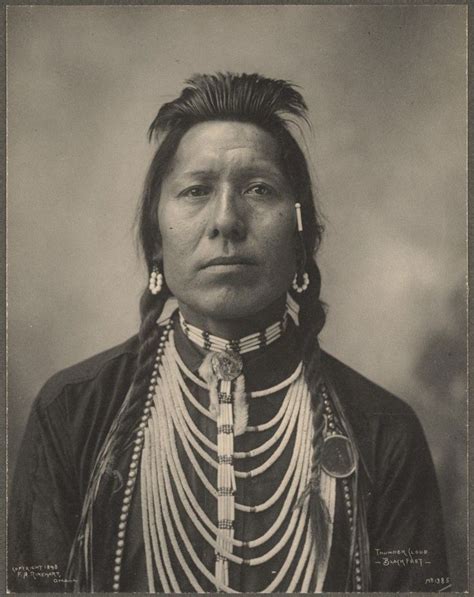 An Old Black And White Photo Of A Native American Woman With Necklaces