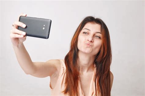 Premium Photo Young Brunette Woman Taking Selfie