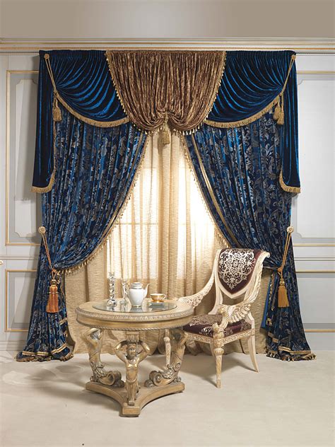 An Elegant Dining Room With Blue Drapes And Curtains
