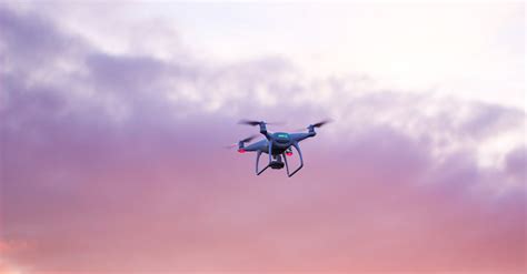 Quadcopter Drone Flying Under Pink Sky · Free Stock Photo