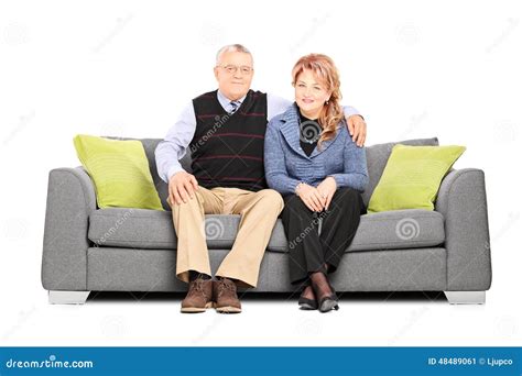 Lovely Mature Couple Posing Seated On Sofa Stock Image Image Of