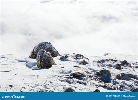 Rocks At The Top Of The Snow Covered Mountain Stock Photo Image Of Blue Hiking