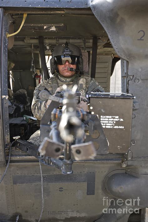 A Uh 60 Black Hawk Door Gunner Manning Photograph By Terry Moore