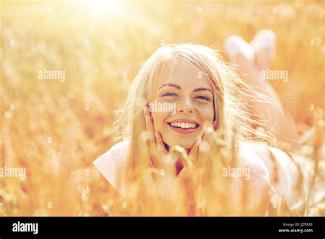 Teenage Girl Lying In Field High Resolution Stock Photography And