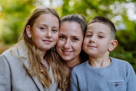 Portrait Of Happy Mother With Her Children In Nature Stock Image