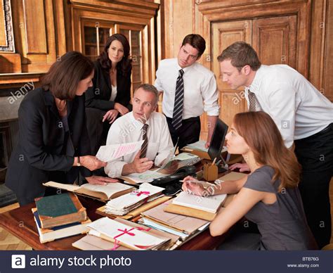 22 lawyers shared what their work is like. Lawyers working at desk in office Stock Photo, Royalty ...