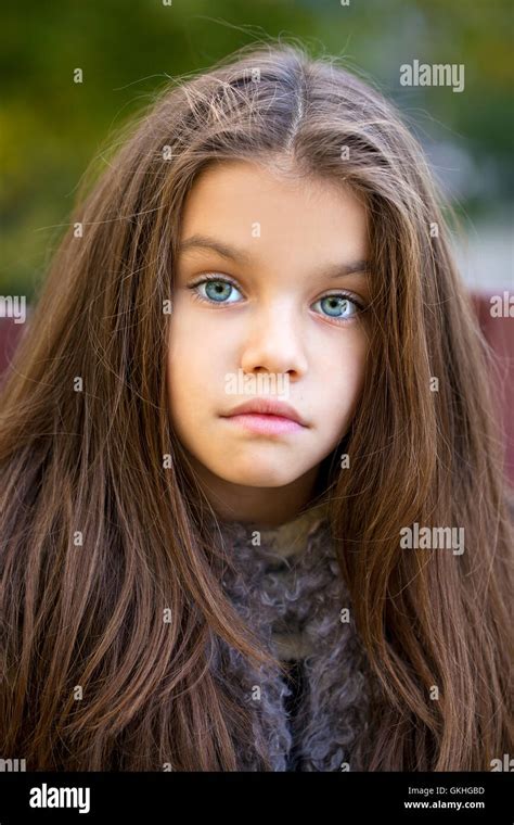 Close Up Portrait Of A Beautiful Nine Year Old Little Girl In Autumn