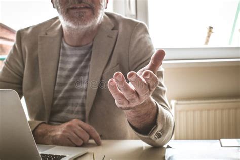 Senior Man In Office Giving Helping Hand Close Up Stock Photo Image