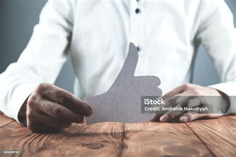Man Showing Paper Thumbs Up Sign Social Network Concept Stock Photo