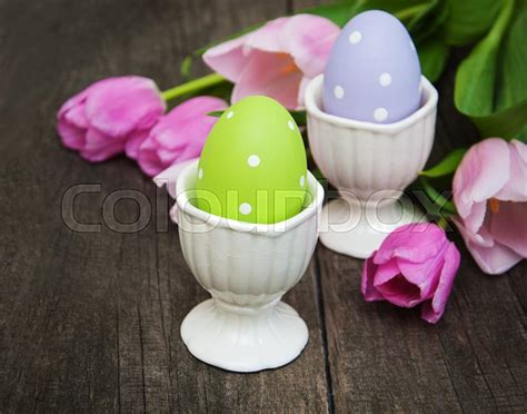 Easter Eggs And Tulips On A Wooden Stock Image Colourbox