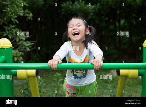 Laughing Girl Playing In A Playground In China Stock Photo Alamy