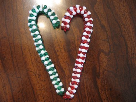 First you paint the whole outside of it white. Tri-Bead Candy Cane Ornaments | Candy cane ornament, Easy ornaments, Ornament crafts