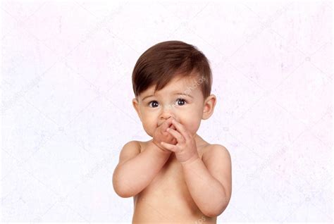 Adorable bébé fille sucer ses bouches image libre de droit par Gelpi