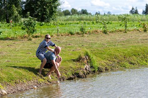 premium photo happy middleaged couple having fun at the pond the concept of a happy relationship