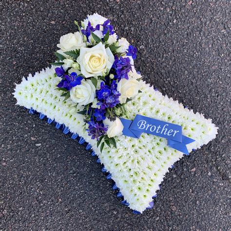 Blue And White Cushion Wreath Funeral Flowers Tribute With Personalised