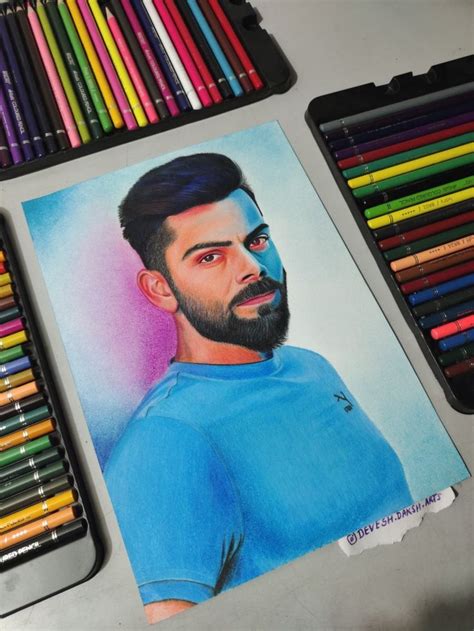 Colored Pencils And Crayons Next To A Drawing Of A Man