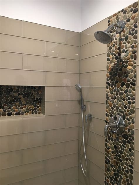 Shower heads are roughly 82″ off the shower pan, and most layouts avoid running decorative tile at that height. Stunning accent strip and niche using Glazed Bali Ocean ...