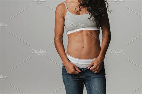 Fit Young Woman Pulling Down Pants High Quality People Images ~ Creative Market