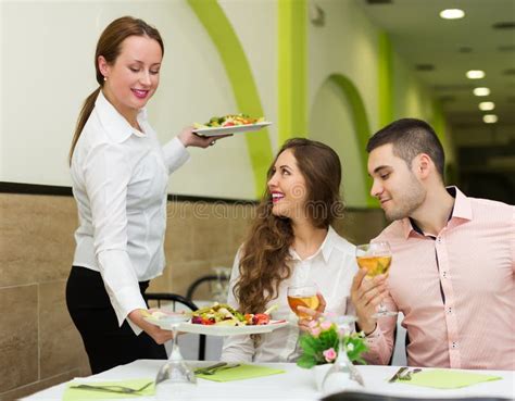 Waitress Serving Food To Visitors Stock Photos Free And Royalty Free