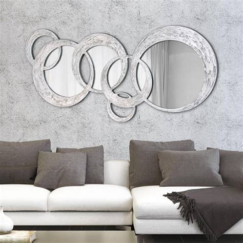 Each piece is made up of five individual, circular mirrors, each with a slender black frames for a contemporary, minimalist feel. 15 Best Ideas of Mirrors Circles for Walls