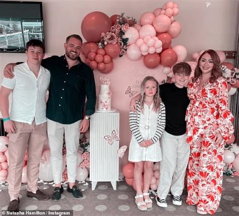 pregnant natasha hamilton shows off her blossoming bump in a floral red jumpsuit at her