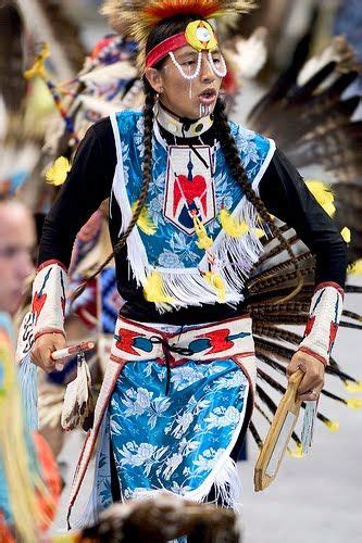 A Native American Man With Feathers On His Head
